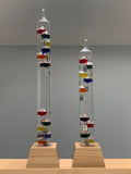 25" Tall Square Tube Galileo Thermometer With Wooden Base